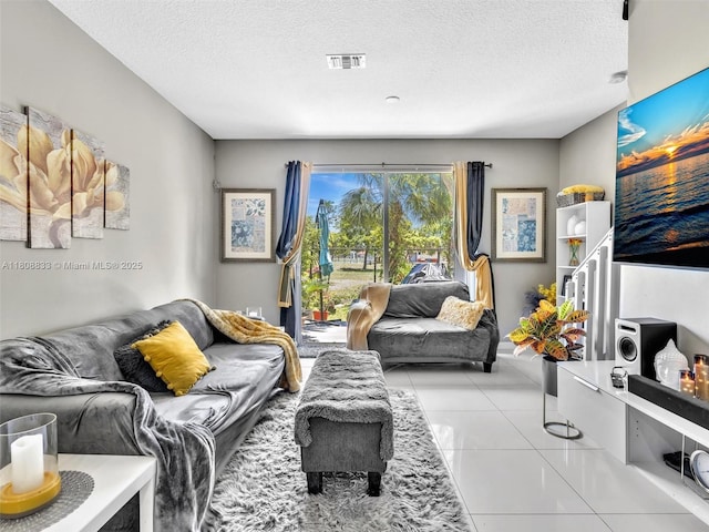 3502 NW 13th St, Lauderhill, FL 33311 - living area with a textured ceiling and light tile patterned flooring