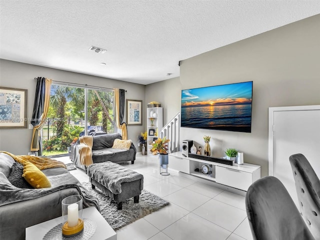 3502 NW 13th St, Lauderhill, FL 33311 - living room with light tile patterned floors, stairway, and a textured ceiling