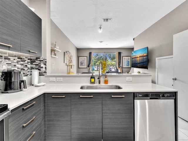 3502 NW 13th St, Lauderhill, FL 33311 - kitchen with gray cabinets, stainless steel dishwasher, a sink, decorative backsplash, and modern cabinets