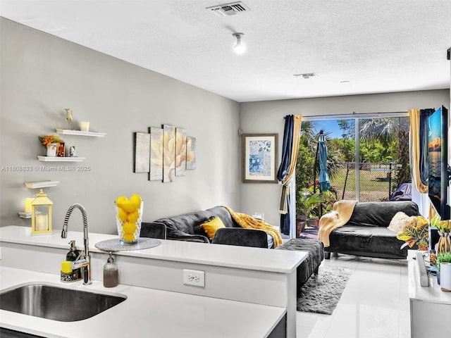 3502 NW 13th St, Lauderhill, FL 33311 - tiled living area with a sink and a textured ceiling