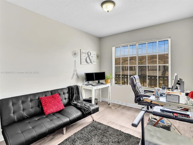 3502 NW 13th St, Lauderhill, FL 33311 - office area with wood finished floors, baseboards, and a textured ceiling