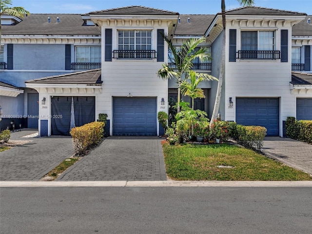 3502 NW 13th St, Lauderhill, FL 33311 - multi unit property featuring a tile roof, a garage, and driveway