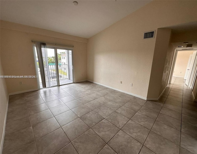 15480 SW 284th St Unit 2304, Homestead, FL 33033 - empty room featuring tile patterned flooring, lofted ceiling, and baseboards