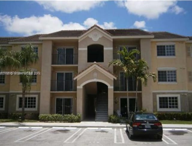 15480 SW 284th St Unit 2304, Homestead, FL 33033 - view of building exterior featuring uncovered parking