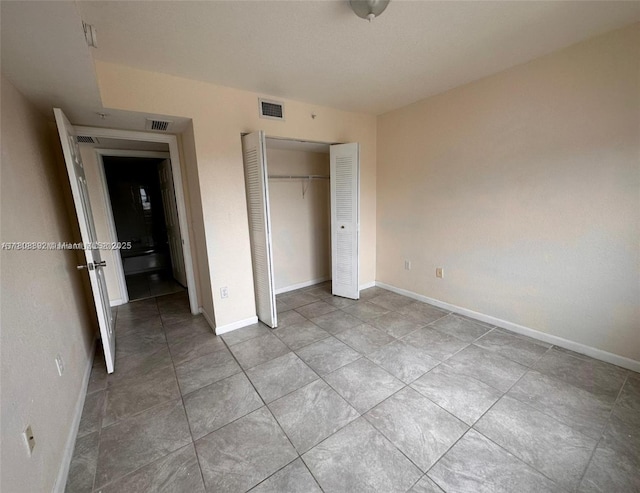 15480 SW 284th St Unit 2304, Homestead, FL 33033 - unfurnished bedroom featuring baseboards, a closet, and light tile patterned floors