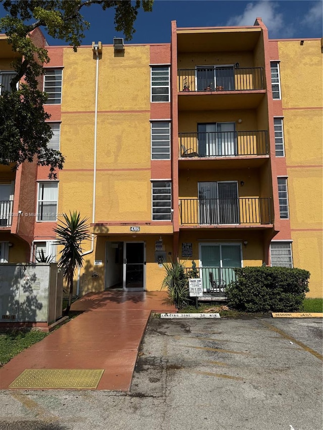 4705 NW 7th St Unit 203-7, Miami, FL 33126 - view of apartment building / complex with uncovered parking