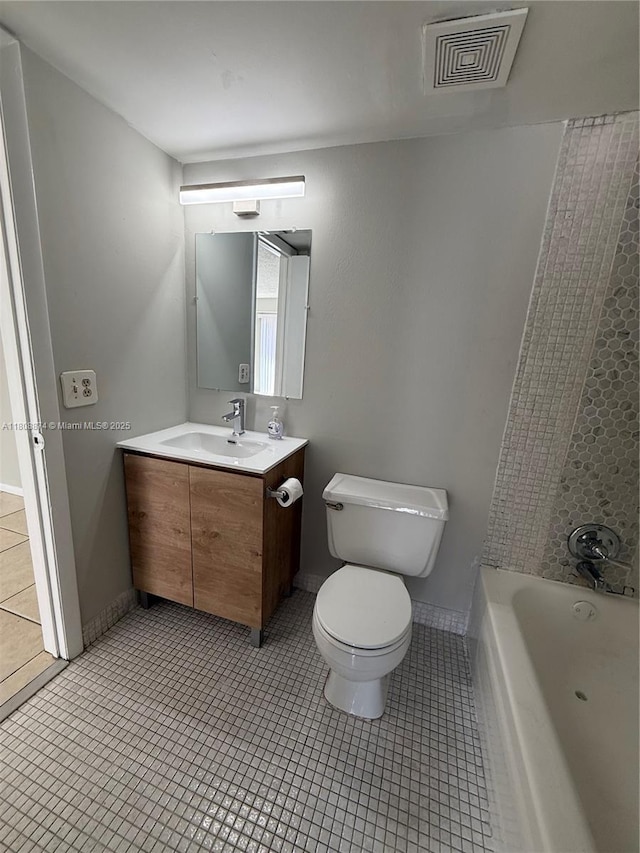 4705 NW 7th St Unit 203-7, Miami, FL 33126 - bathroom featuring toilet, vanity, and tile patterned floors