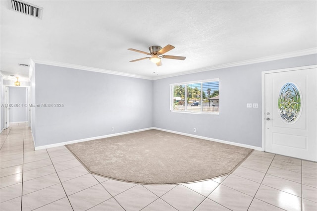 1520 N 25th Ave, Hollywood, FL 33020 - entryway with ornamental molding, a ceiling fan, light tile patterned floors, baseboards, and light colored carpet