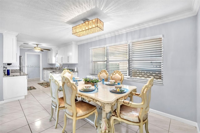 1520 N 25th Ave, Hollywood, FL 33020 - dining room featuring light tile patterned floors, ceiling fan, baseboards, and crown molding