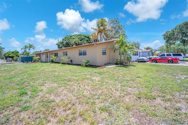 1520 N 25th Ave, Hollywood, FL 33020 - view of home's exterior featuring stucco siding and a lawn