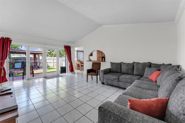 10362 SW 208th Ln, Cutler Bay, FL 33189 - living room with tile patterned floors, vaulted ceiling, crown molding, and french doors