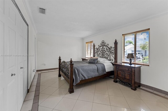 10362 SW 208th Ln, Cutler Bay, FL 33189 - bedroom with baseboards, crown molding, and light tile patterned floors