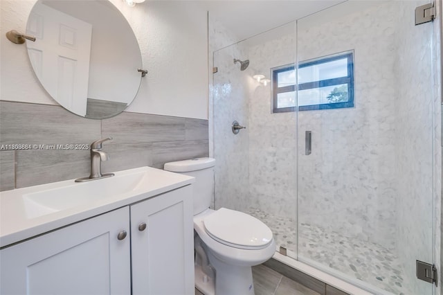 2447 Fletcher St, Hollywood, FL 33020 - bathroom with vanity, tile walls, a stall shower, toilet, and tile patterned flooring