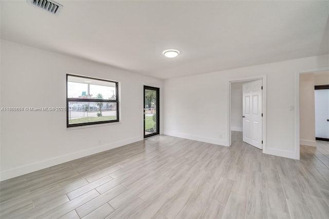 2447 Fletcher St, Hollywood, FL 33020 - empty room with light wood-type flooring and baseboards