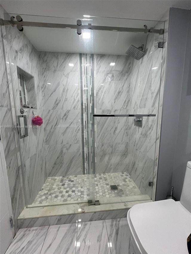 4550 NW 79th Ave Unit 1D, Doral, FL 33166 - full bathroom featuring toilet and a marble finish shower