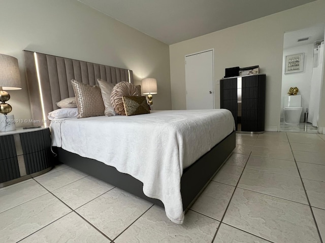 4550 NW 79th Ave Unit 1D, Doral, FL 33166 - bedroom featuring light tile patterned floors