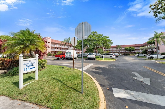 9401 Sunrise Lakes Blvd Unit 307, Sunrise, FL 33322 - view of asphalt street featuring traffic signs