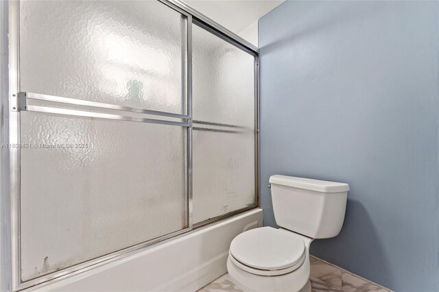 9401 Sunrise Lakes Blvd Unit 307, Sunrise, FL 33322 - full bath featuring marble finish floors, toilet, and enclosed tub / shower combo