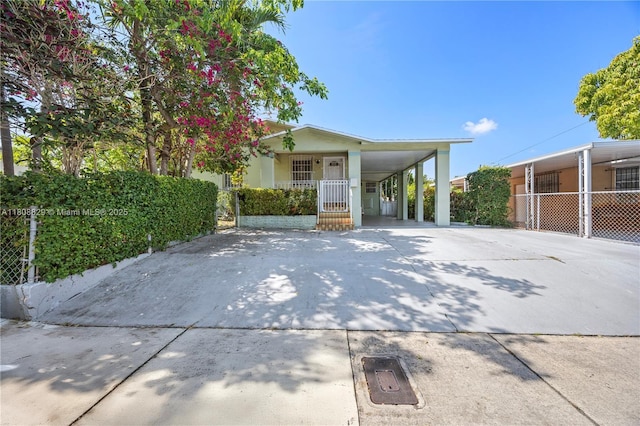 5762 SW 2nd St, Miami, FL 33144 - view of front of house featuring driveway and an attached carport