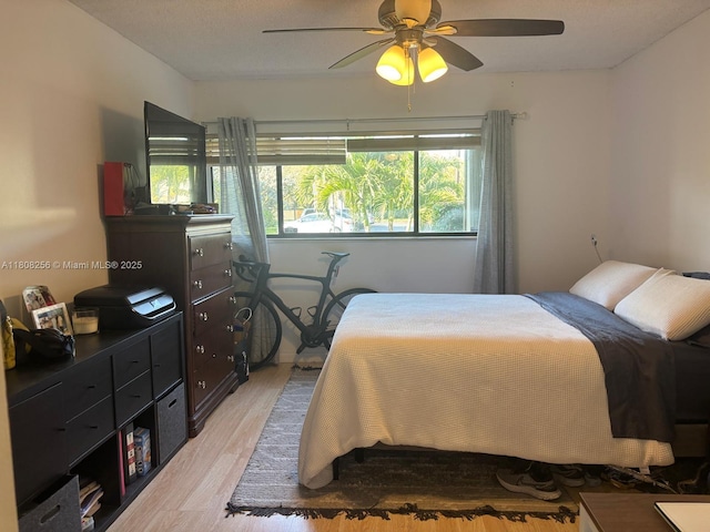 771 NE 199th St Unit 103, Miami, FL 33179 - bedroom featuring light wood-type flooring and a ceiling fan