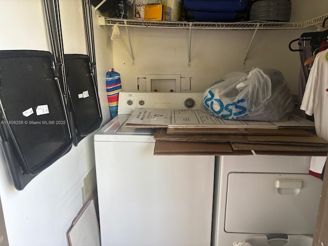 771 NE 199th St Unit 103, Miami, FL 33179 - laundry area featuring separate washer and dryer