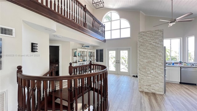 168 Indian Mound Trl, Tavernier, FL 33070 - foyer entrance with french doors, a towering ceiling, light wood-type flooring, ceiling fan, and ornamental molding