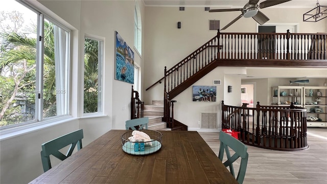168 Indian Mound Trl, Tavernier, FL 33070 - dining space with a towering ceiling, healthy amount of natural light, ceiling fan, and stairway