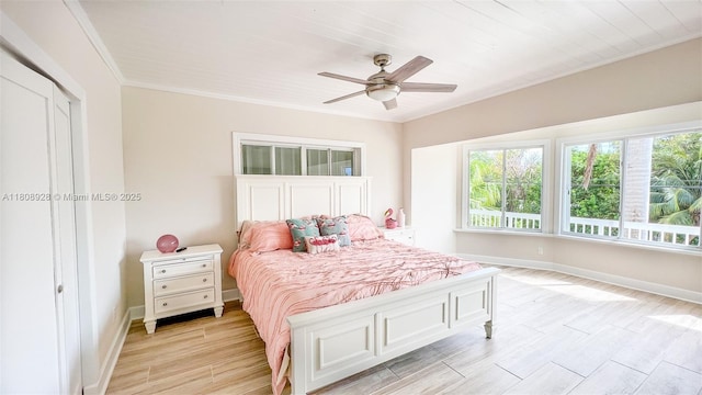 168 Indian Mound Trl, Tavernier, FL 33070 - bedroom featuring baseboards, light wood-style flooring, crown molding, and ceiling fan