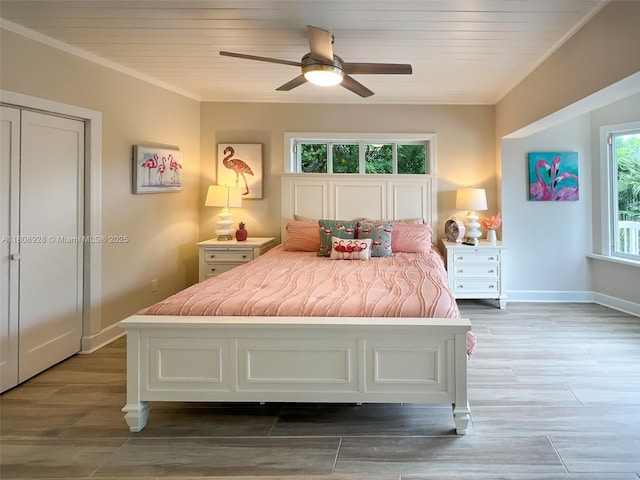 168 Indian Mound Trl, Tavernier, FL 33070 - bedroom featuring baseboards, a ceiling fan, crown molding, and wood finished floors