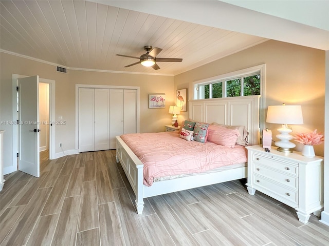 168 Indian Mound Trl, Tavernier, FL 33070 - bedroom featuring a closet, light wood-type flooring, ornamental molding, wood ceiling, and baseboards
