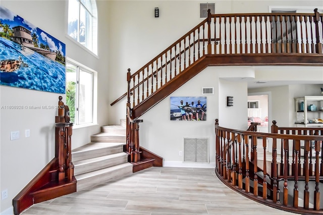 168 Indian Mound Trl, Tavernier, FL 33070 - stairway with a high ceiling and baseboards