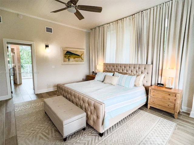 168 Indian Mound Trl, Tavernier, FL 33070 - bedroom featuring baseboards, wood finished floors, ceiling fan, and ornamental molding