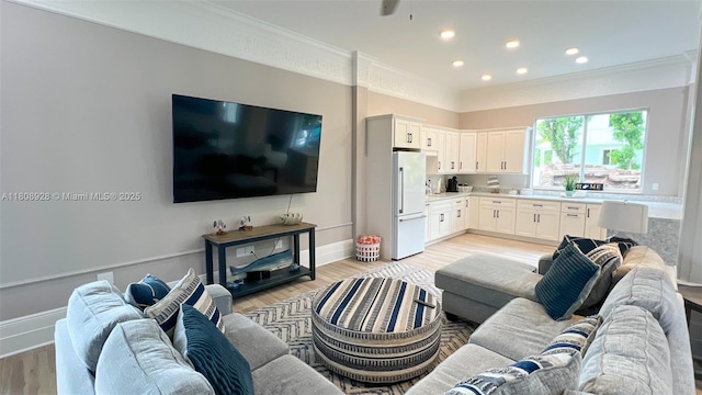 168 Indian Mound Trl, Tavernier, FL 33070 - living area with light wood-style floors, crown molding, baseboards, and recessed lighting