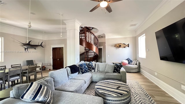 168 Indian Mound Trl, Tavernier, FL 33070 - living room with stairway, ceiling fan, light wood-type flooring, ornamental molding, and ornate columns