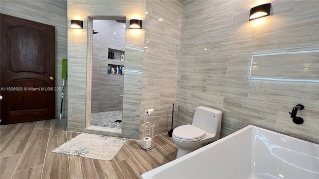 168 Indian Mound Trl, Tavernier, FL 33070 - bathroom with a freestanding bath, walk in shower, tile walls, and toilet