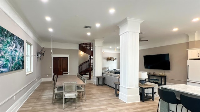 168 Indian Mound Trl, Tavernier, FL 33070 - dining space with ornate columns, stairway, crown molding, light wood-style floors, and recessed lighting