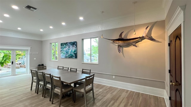 168 Indian Mound Trl, Tavernier, FL 33070 - dining area featuring recessed lighting, light wood-type flooring, french doors, baseboards, and crown molding