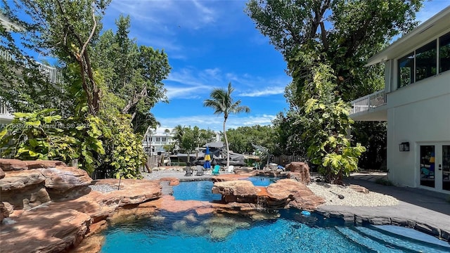 168 Indian Mound Trl, Tavernier, FL 33070 - swimming pool featuring french doors and a patio area