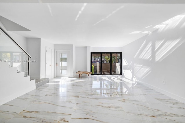 16449 NE 26th Ave Unit 16, North Miami Beach, FL 33160 - unfurnished living room featuring stairs and marble tiled flooring