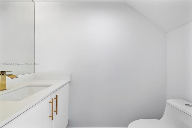 16449 NE 26th Ave Unit 16, North Miami Beach, FL 33160 - half bath with toilet, vanity, and lofted ceiling
