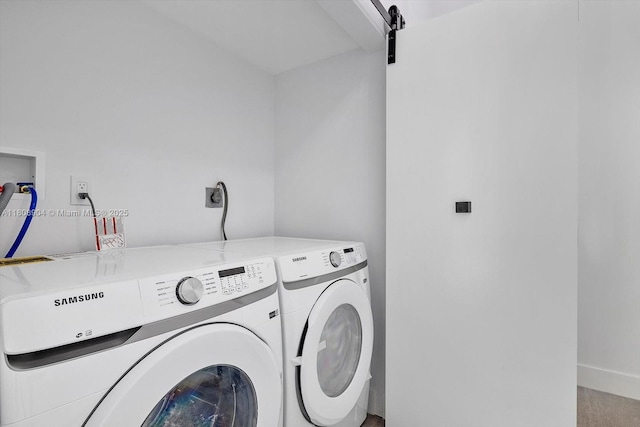 16449 NE 26th Ave Unit 16, North Miami Beach, FL 33160 - laundry room with washing machine and clothes dryer and a barn door