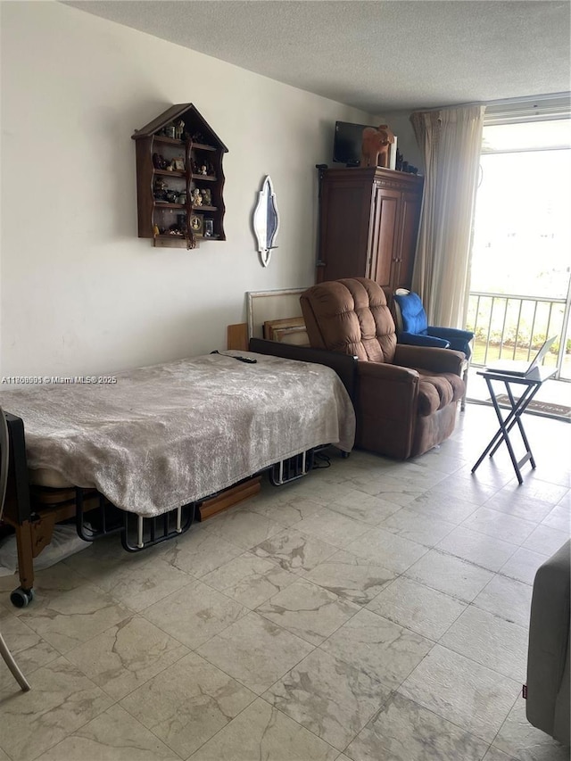 3030 Marcos Dr Unit T504, Aventura, FL 33160 - bedroom with a textured ceiling