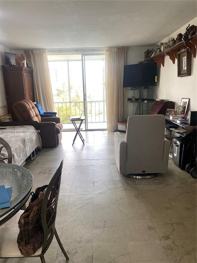 3030 Marcos Dr Unit T504, Aventura, FL 33160 - living room with a textured ceiling