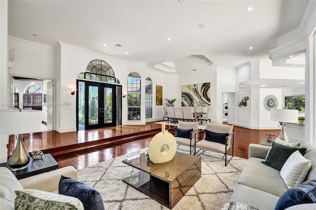 169 Dockside Cir, Weston, FL 33327 - living room with ornamental molding, recessed lighting, wood finished floors, baseboards, and french doors