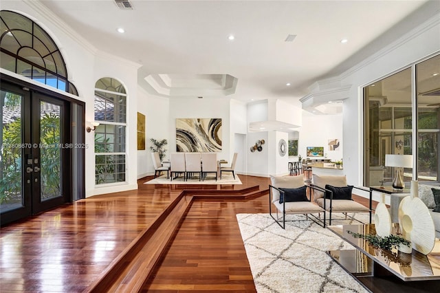 169 Dockside Cir, Weston, FL 33327 - living room with french doors, ornamental molding, hardwood / wood-style flooring, and recessed lighting