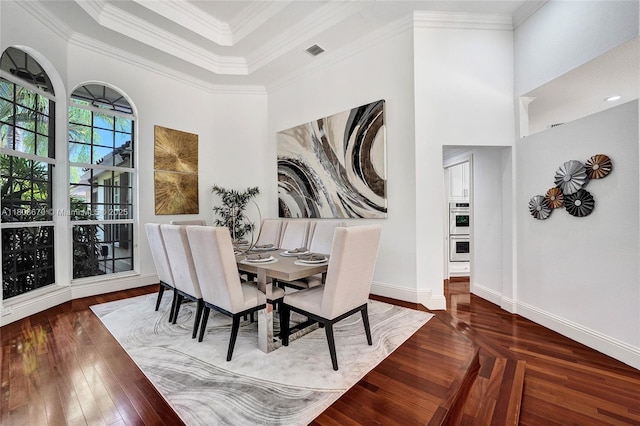 169 Dockside Cir, Weston, FL 33327 - dining space with hardwood / wood-style floors, ornamental molding, baseboards, and a towering ceiling