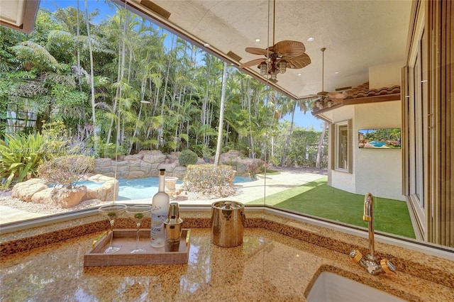 169 Dockside Cir, Weston, FL 33327 - unfurnished sunroom featuring a sink and view of wooded area
