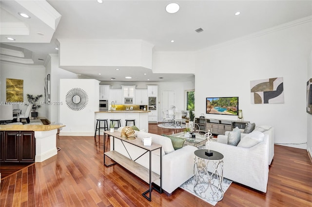 169 Dockside Cir, Weston, FL 33327 - living area featuring ornamental molding, dark wood-type flooring, and recessed lighting