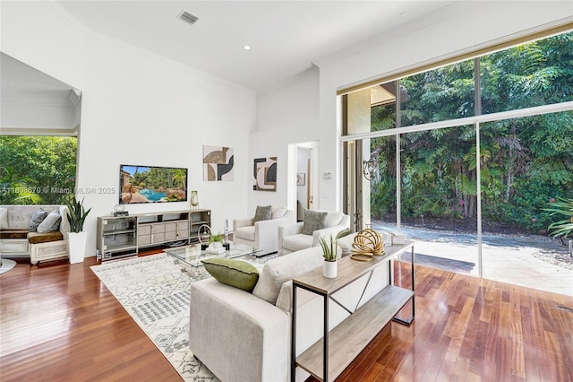 169 Dockside Cir, Weston, FL 33327 - living room featuring crown molding, plenty of natural light, and dark wood-style floors