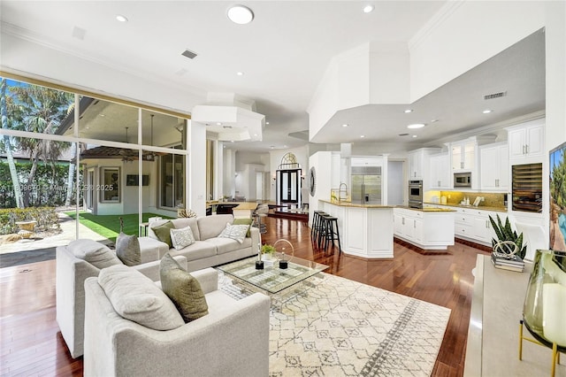 169 Dockside Cir, Weston, FL 33327 - living area featuring crown molding, plenty of natural light, dark wood finished floors, and recessed lighting